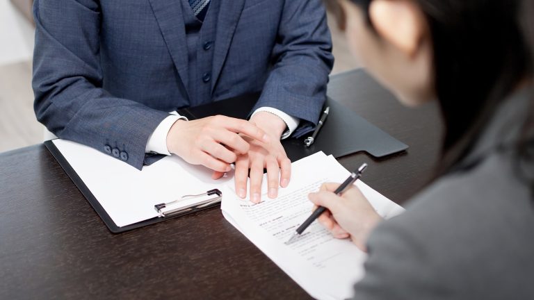 Asian lawyer explaining the contract