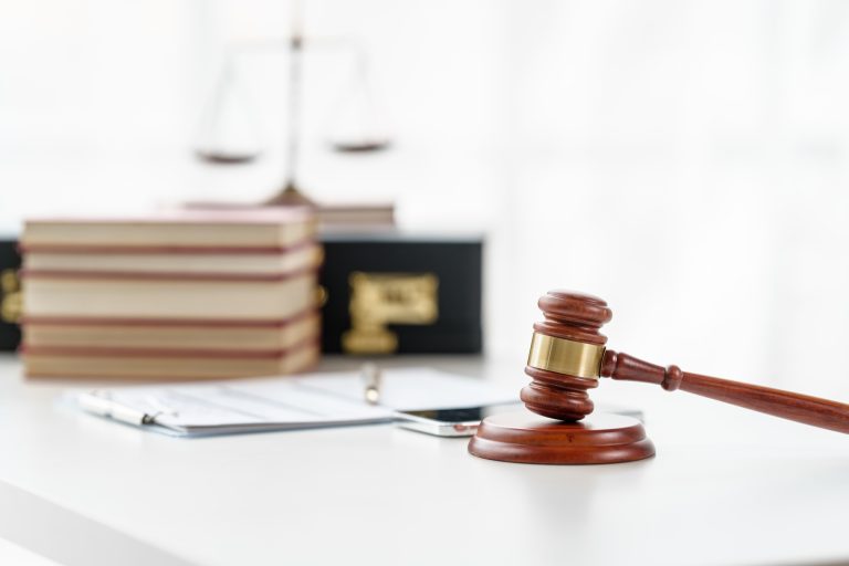 Property Lawyer desk with gavel and contract paper of attorney, nobody, no people